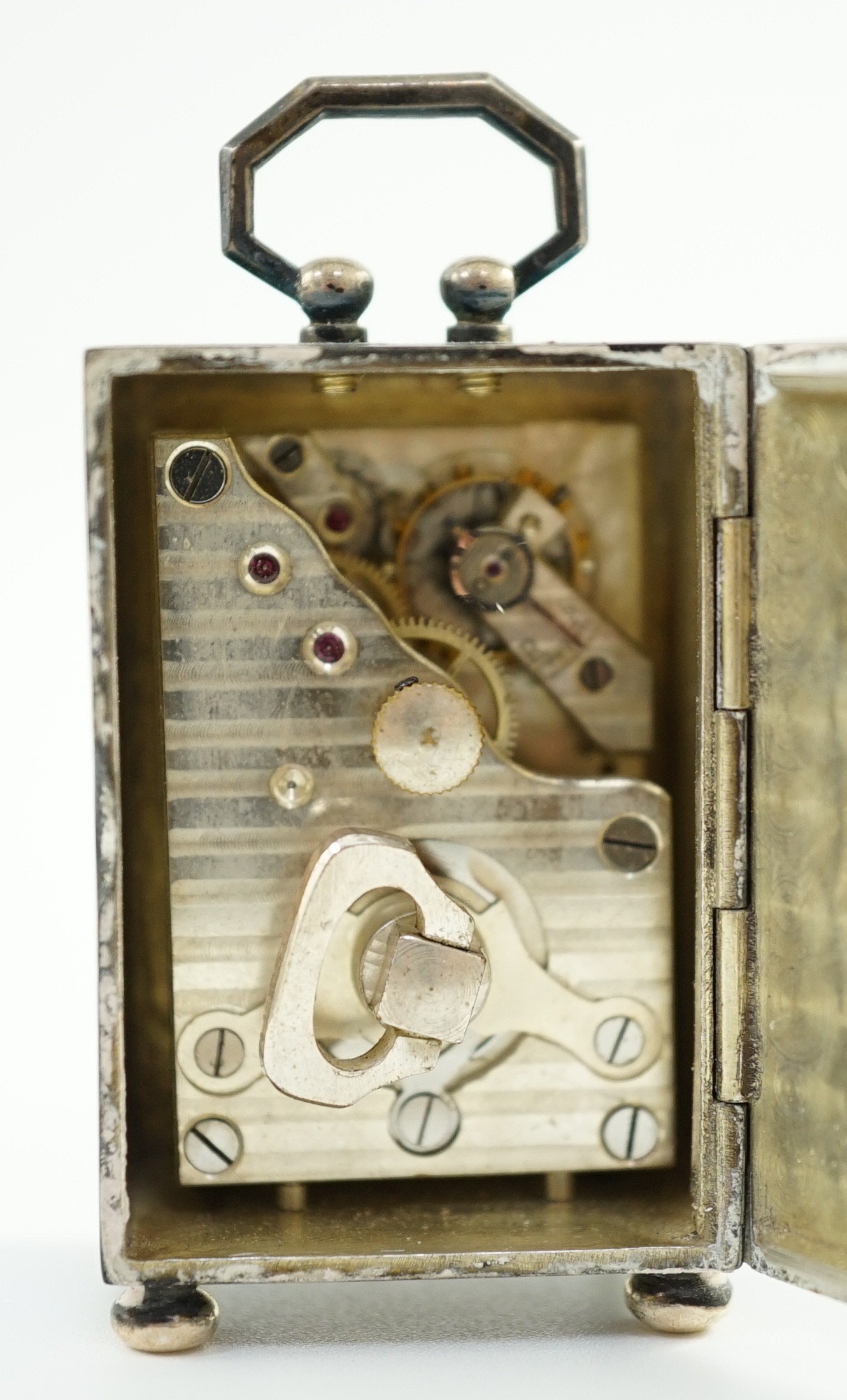 A George V Swiss blue enamel and silver cased miniature carriage timepiece, import marks for Arthur George Rendell, London, 1924, 43mm, on bun feet, in gilt tooled leather carrying case